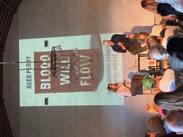 Alison Martin on stage with Alex Perry at the Blood Will Flow event